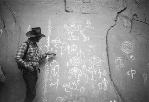 1970s Pete Steel giving his interpretation of
pictographs on a Grand Gulch pack trip.